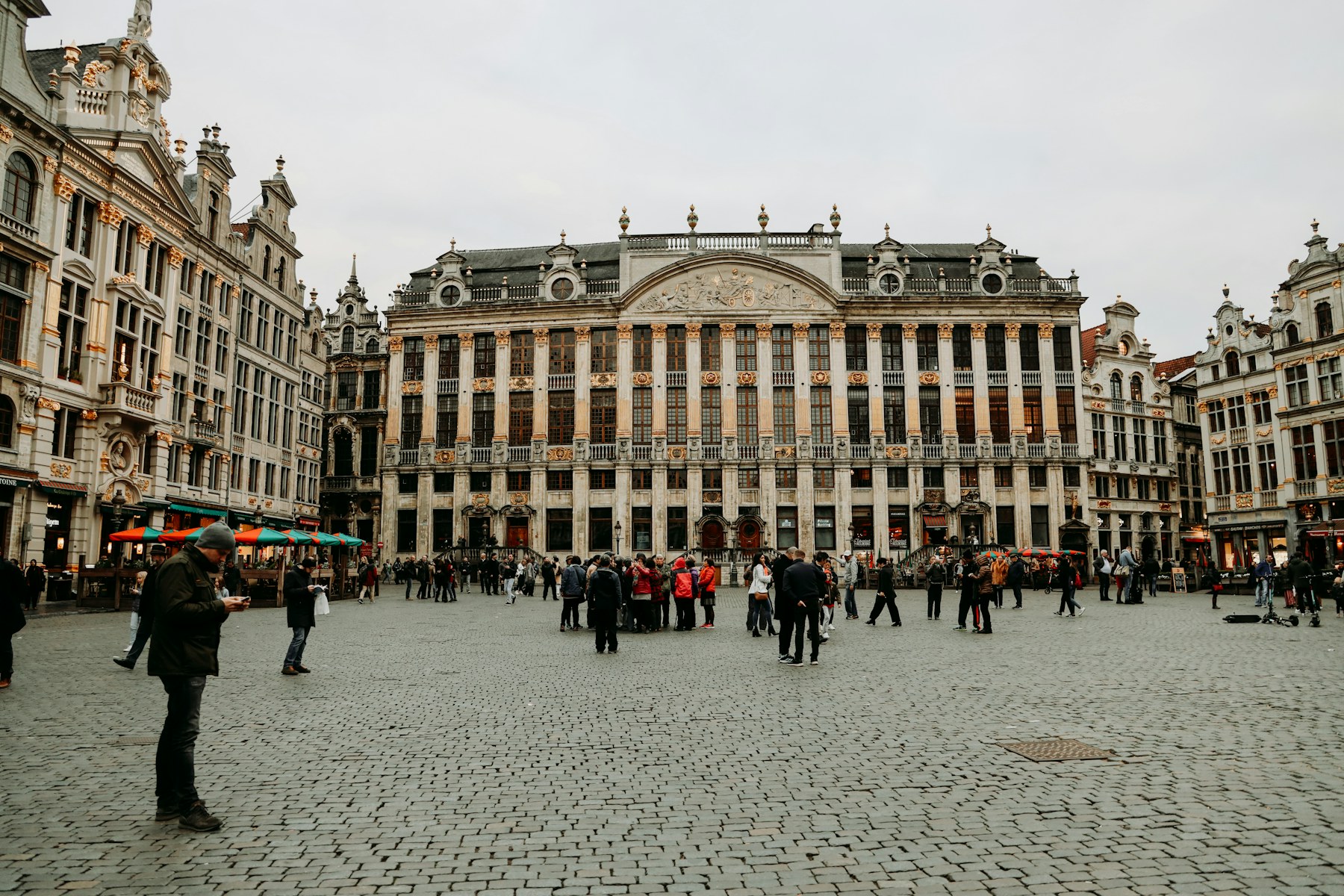People walking across Brussels Grand-Place